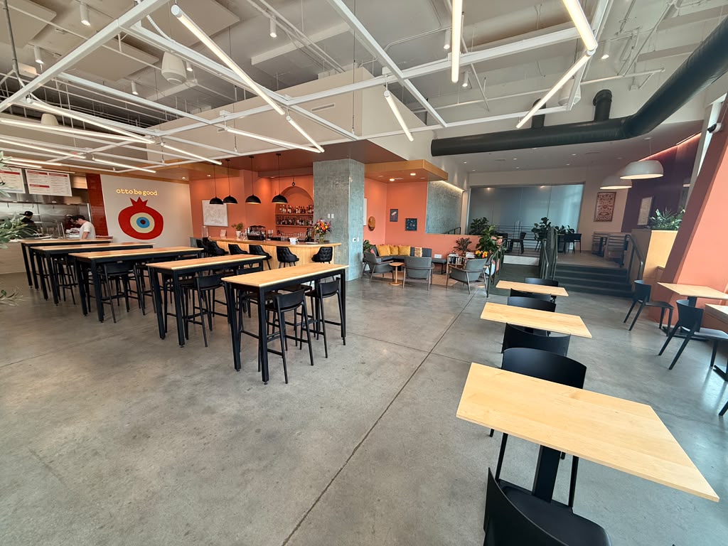 Spacious Otto Richmond dining room with communal tables, bar and lounge